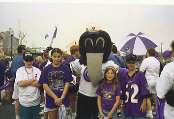Roost #41 junior members pose with Raven's mascot Poe.