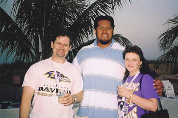 Shaun and Kim McKee pose with Ravens guard Edwin Mulitalo at the Friday evening gathering.