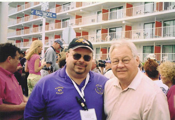 Tony Berkheimer poses with Baltimore Colts announcer Tom Matte.