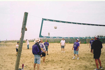Mike McGuigan's serve soars over the net.