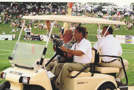 Ravens owner Art Model watches his charges perform.