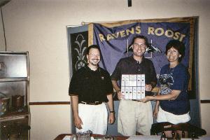 Roost #41 Raffle Chairman Mike McGuigan and President Joyce Berkheimer present the raffle drawing winner with Ravens season tickets