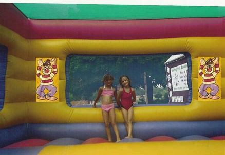 The kids pose inside the new trampoline house.