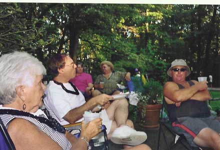 Everyone enjoys the food at the cookout.