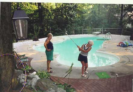 Pat Chamberlain tries her stroke at poolside.