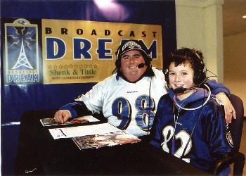 George Christas and George Jr. in broadcast booth at Vikings game