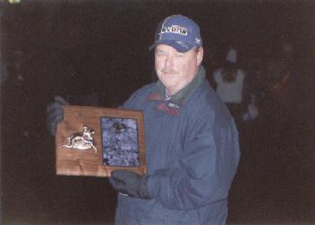 Wayne Shorb displays Ravens Unsung Hero Award at Vikings game