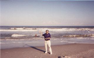 Alan Epstein directs a wave of Ravens good fortune at Jacksonville Beach prior to the game