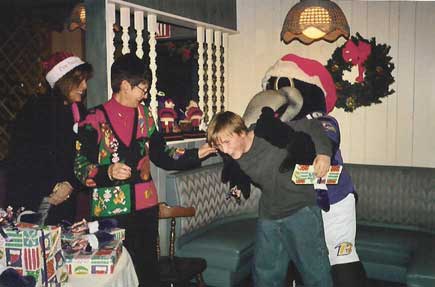 Poe jokes around with one of the kids - maybe he didn't like his gift!