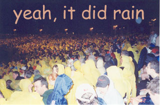 Trying to watch the fireworks that nearly got cancelled TWICE because of rain.&nbsp; And did it rain!