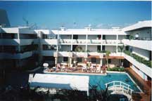 Inner lounge area, rooms, and pool