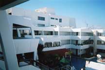 Inner lounge area, rooms, and pool