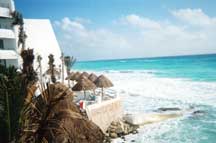 Ocean and thatched lounge area as seen from ocean-side pool