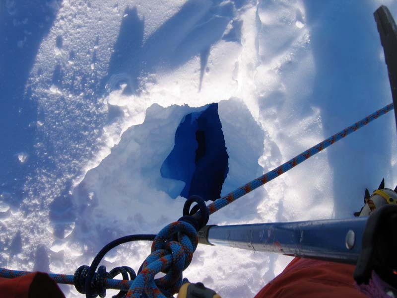 Stradaling a Crevasse, Ice Plateau, East Antarctica