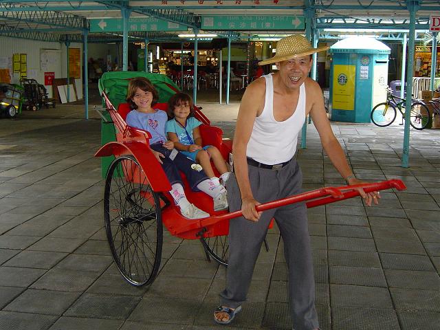 Taking a "ride" on a tourist rickshaw.