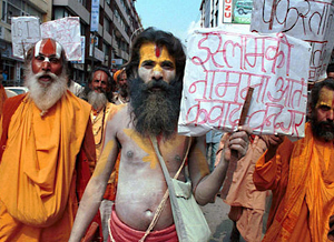 Hindu holy men take part in a protest against Osama bin Laden on the streets of 
                            Katmandu. The banner at center says 'Stop terrorism in the name of Islam.'