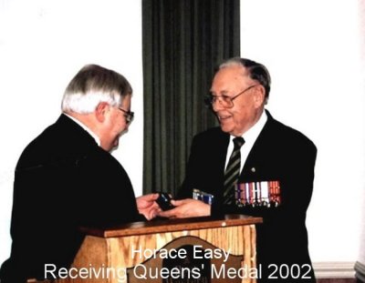 [Horace Easy receiving Queen's Medal 2002]