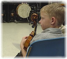 doesn't anyone comb this kid's hair?