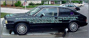 in front of city hall, a car decorated with the ten commandments...oh, what fun this could become...