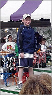 Hey you, little kid: Taylor beams at his fans as he awaits his third-place medal, St Pat's Day 2002.