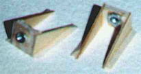 The wing retaining screws thread into these