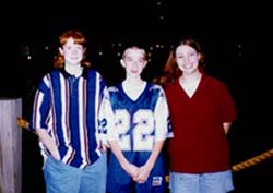 3 kids by river