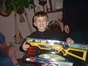 My cousin Lenny holding up his new toy gun.