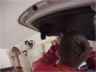 Unscrewing plastic cover inside of rear hatch