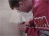 Carefully pressing Emblem to Body