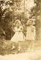 Dee standing, with MaryLee in swing