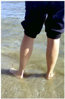Piernas en la playa