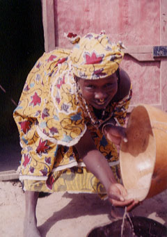 Mama washing millet