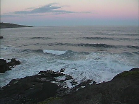 10 foot waves at night while standing on a 100 foot cliff.