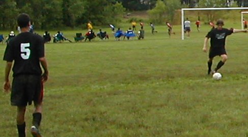 Jersey with the ball while Gary waits for the pass