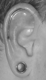 a wicked custom industrial by Sara - he brought in an idea on paper, the next day he came back &  left with a wicked custom piercing
