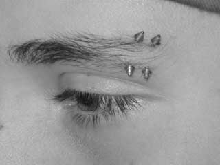 double eyebrow body piercing on Steve, a wicked dude & long time client
