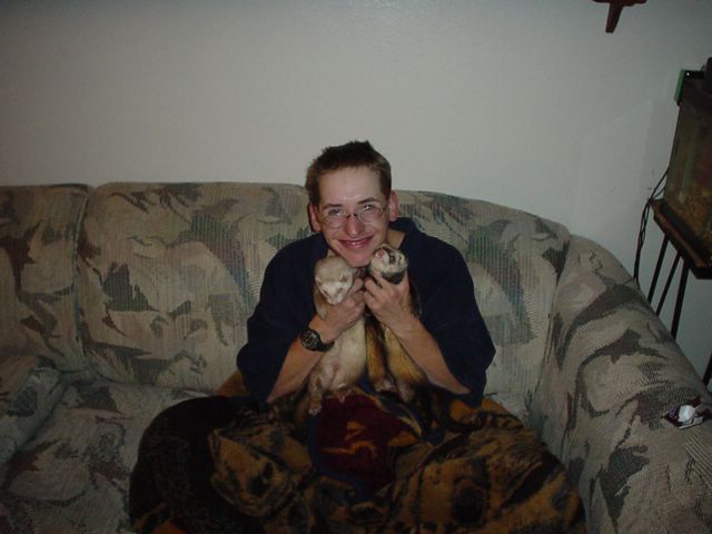 Corey is just chilling out with with our ferrets Stinky and Sammy