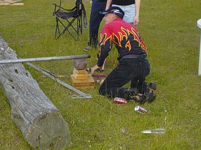 This is how we started the fire. Corey got a long pipe and stuffed a big ass bottle rocket in it after blessing the pile with 