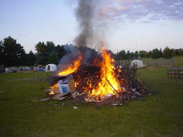 We all ran back as the bottle rocket ignited the fire.