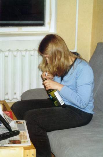 Ellie is opening the wine