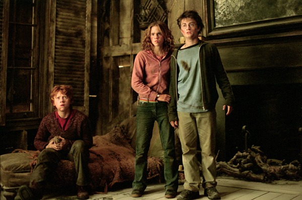 Hermione, Harry and Ron on the floor, holding Scabbers, in the Shrieking Shack.