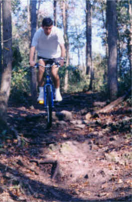 Stefan riding down a medium skill level trail.