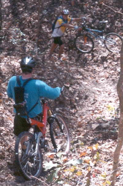 I'm pushing my bike uphill, so get out of the way!