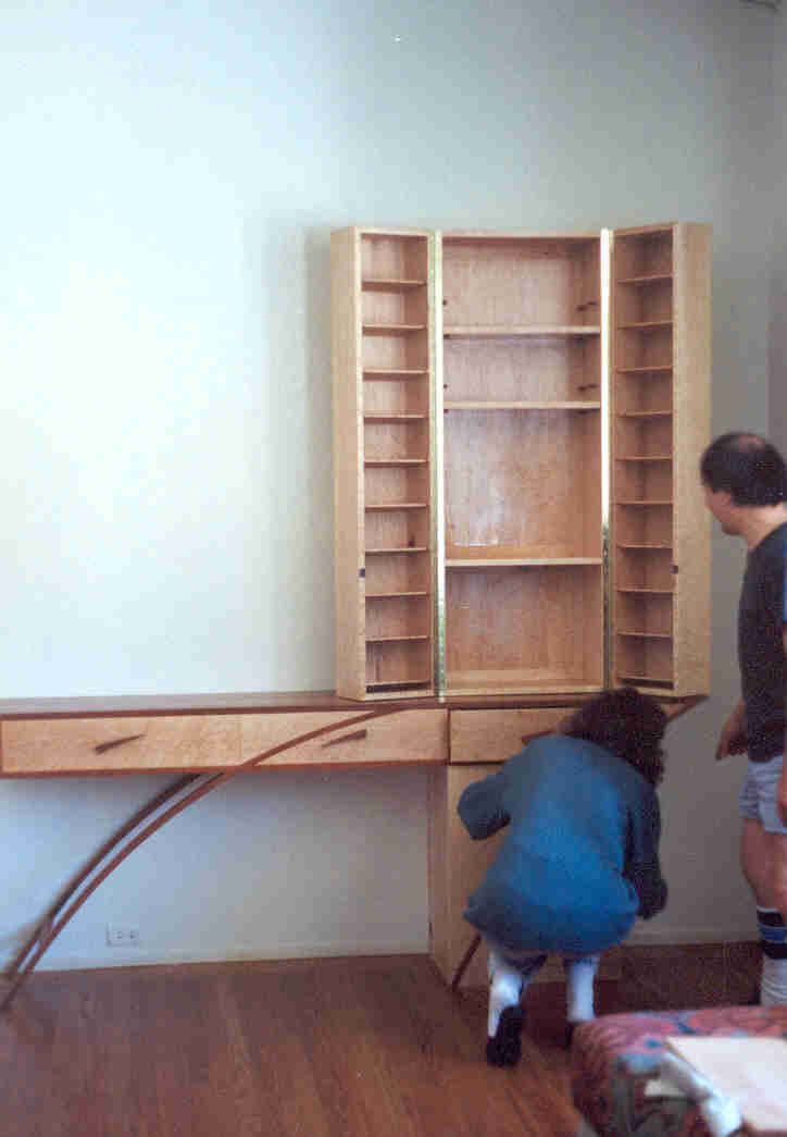 Cantilever Entertainment Unit, The upper vertical unit has CD shelvings on the inside of the doors with adjustable shelves on the main part.&nbsp; The lower unit is for the audio units.&nbsp; The horizontal unit has drawers and rests on the lower unit, balanced by the weight of the upper unit.