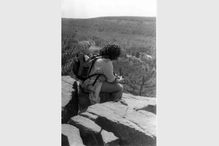 She overlooks the vast wilderness that could be destroyed.