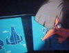 At a compu screen(s)