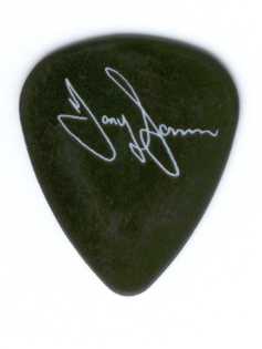 Tony Iommi's pick. This pick Personally came from the nubs of Tony 'The Master's' fingers, while on tour in Europe, Summer of 1994. Warped pick! He must have really been rippin'!