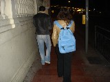 There is actually a girl behind that blue bag...