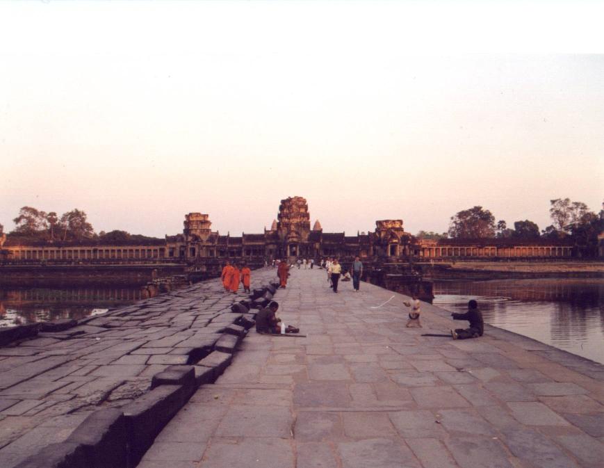 Notice the different sides of the walking bridge towards Angkor Wat.. the left is original...