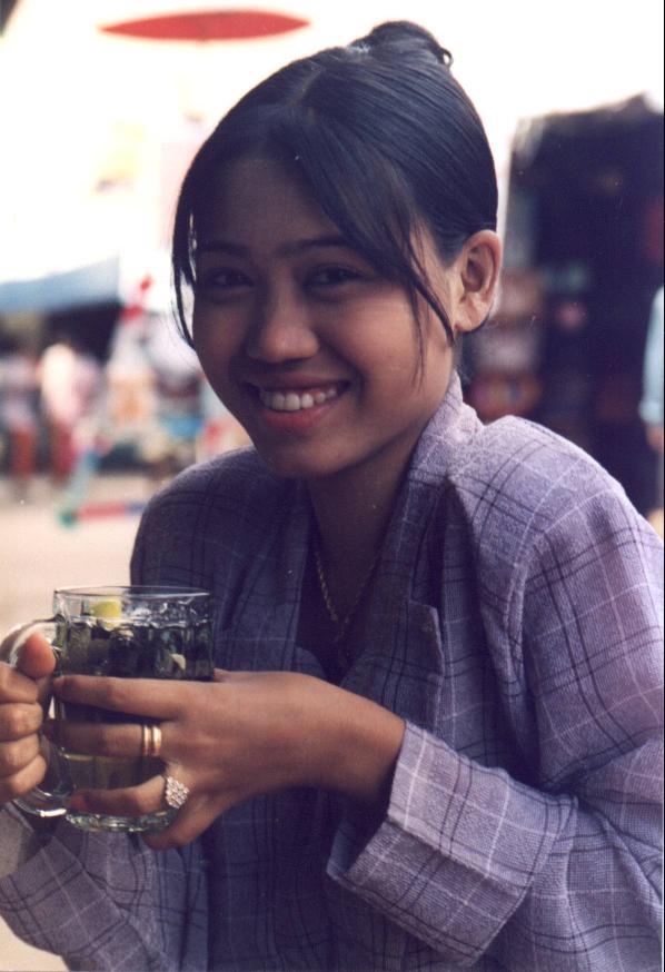 Myanmar girl at Pyay market stand very willing to pose for a cute picture !